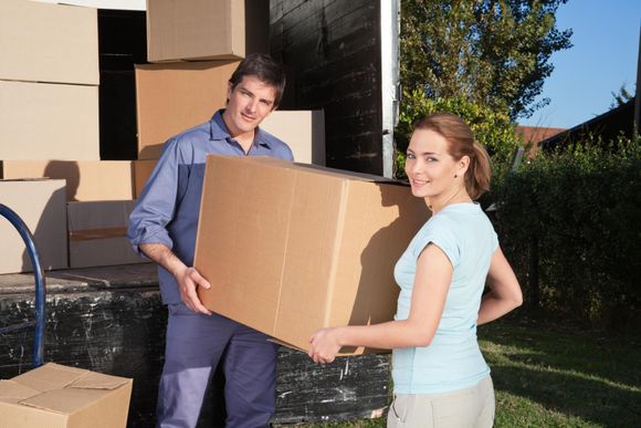 mover and lady carrying a box