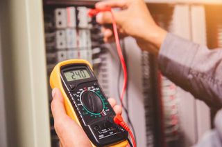 Electrician Measuring Voltage — Forrest, IL — RTJ Electric Electrician Measuring Voltage — Forrest, IL — RTJ Electric