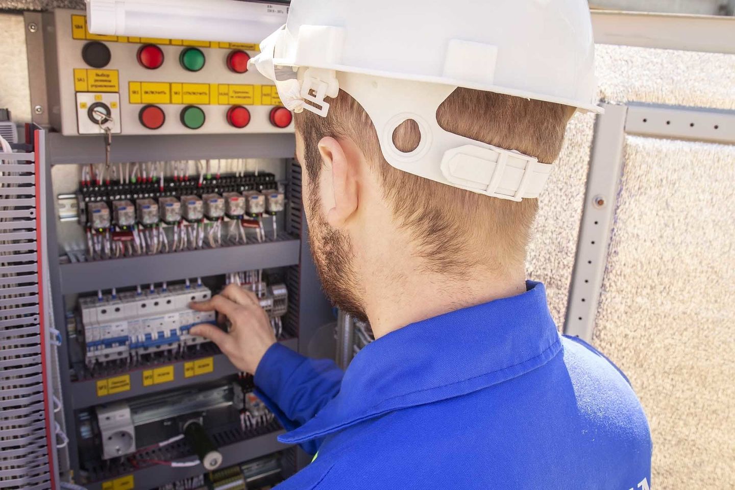 Electrician Switching Off Circuit Breaker — Forrest, IL — RTJ Electric Electrician Switching Off Circuit Breaker — Forrest, IL — RTJ Electric