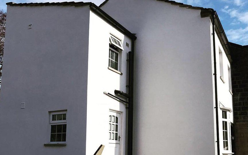 white house with rendered walls