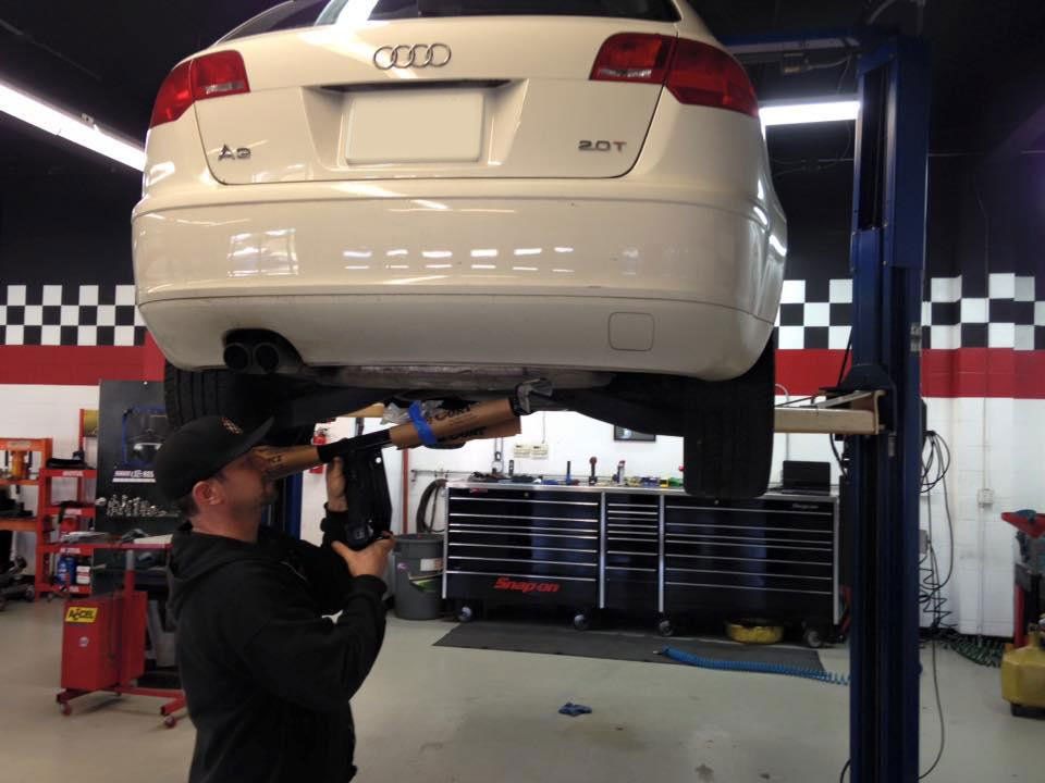 Repair Nissan — Car Wrapper Attaching Tinting Foil to Window in Santa Cruz, CA