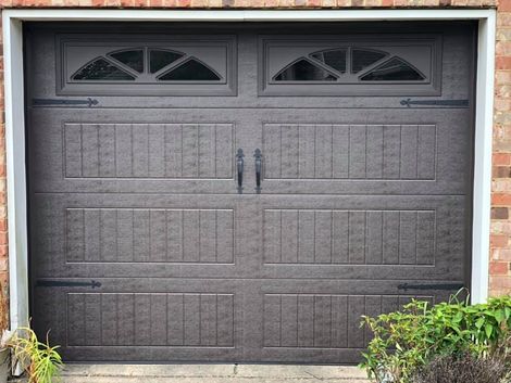 Man Pulling Down the Garage Door — Spanish Fort, AL — Garage Door Medics