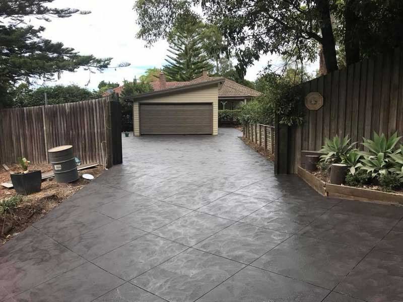 garage with new concrete driveway