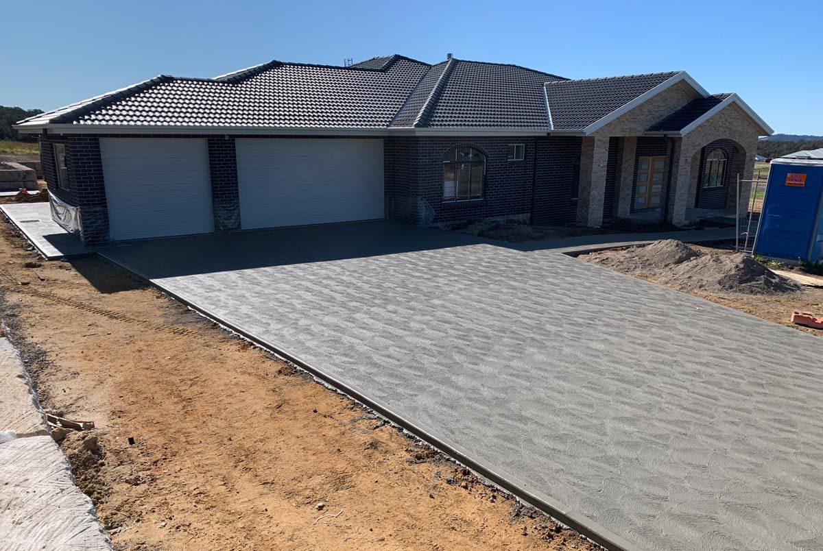 house with long sloping driveway