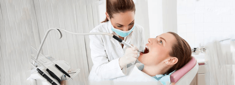 woman at the dentist - new patient forms