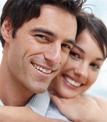 couple hugging - regular exams and cleanings