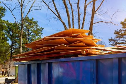 wood boards in rubbish bin