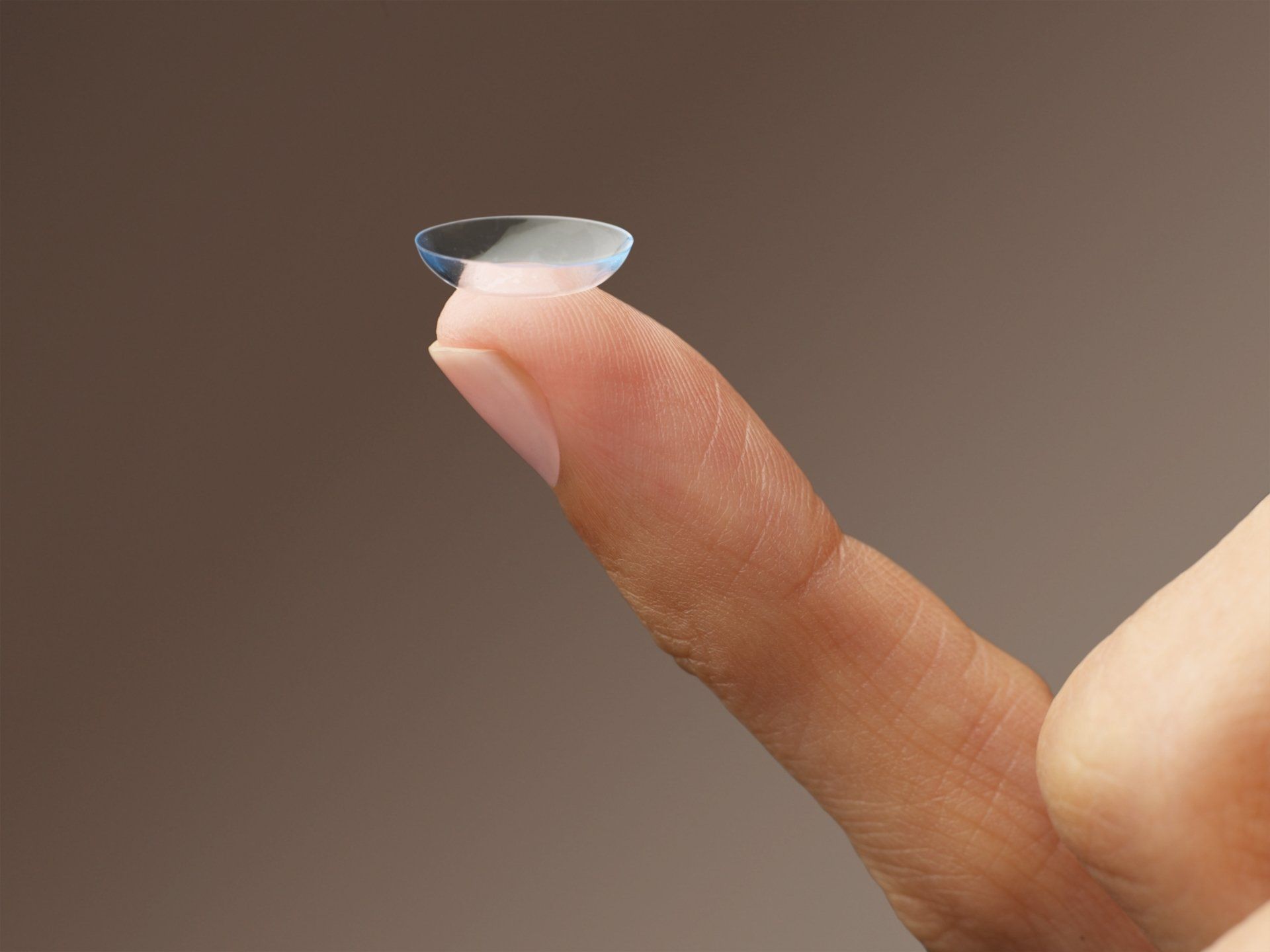 contact lens on finger