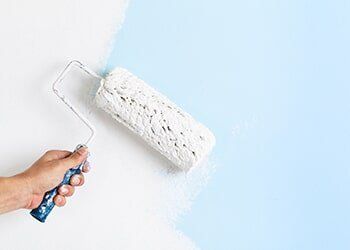 House Painting Services — Close Up of Painter Hand Painting a Wall in Damascus, OR House Painting Services — Close Up of Painter Hand Painting a Wall in Damascus, OR