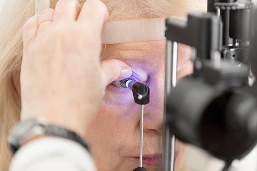 a senior undergoing glaucoma test a senior undergoing glaucoma test