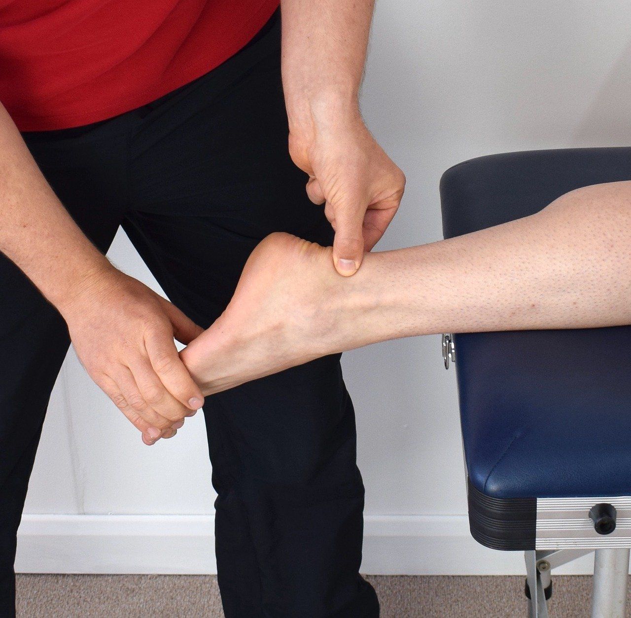 massaging achilles tendon