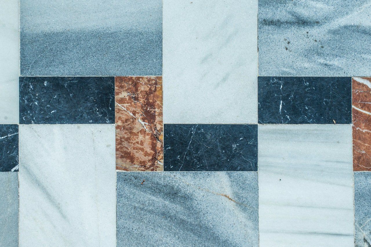 GLEAMING TILE AND STONE