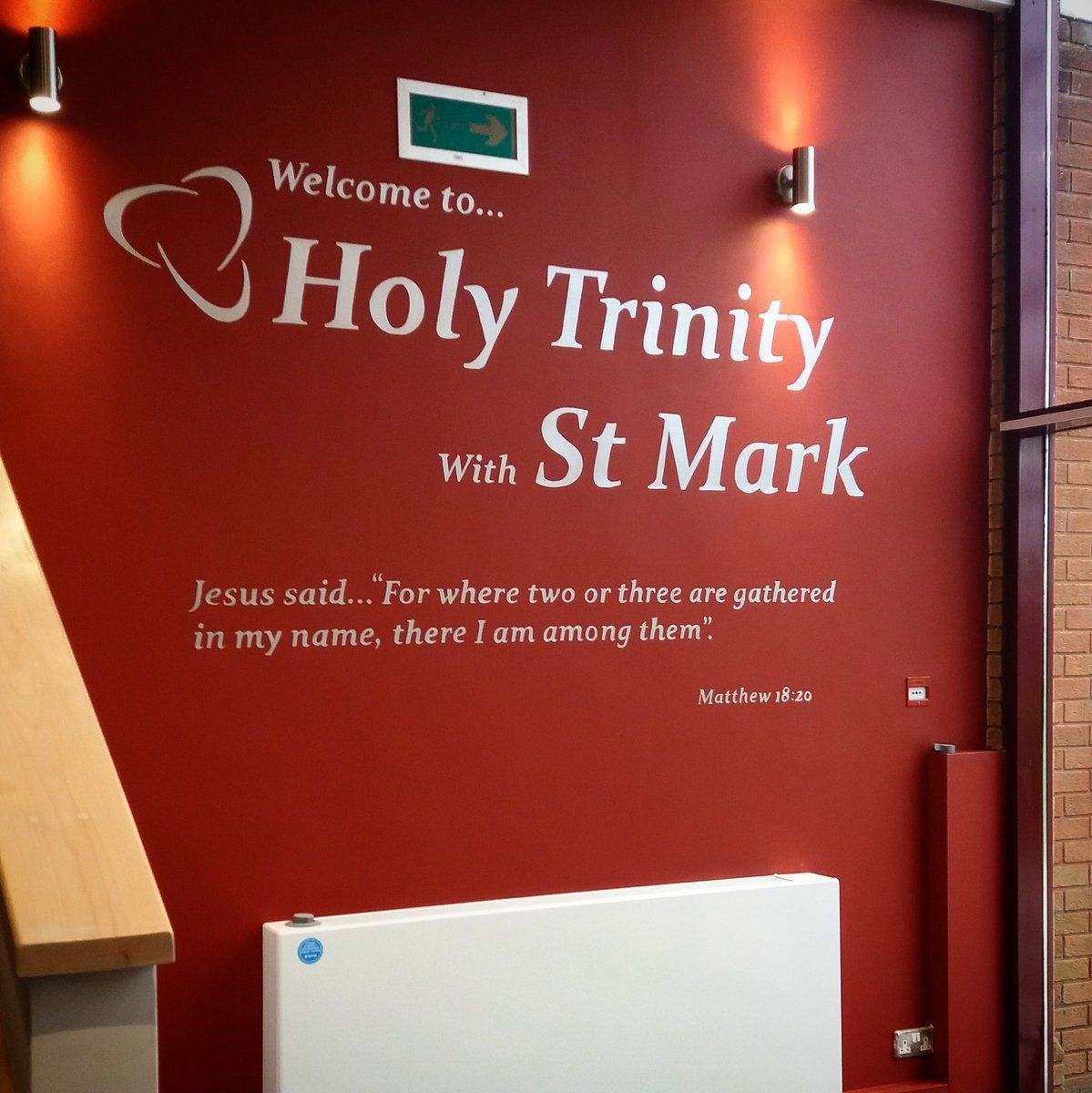 Holy Trinity with St Mark logo in church entrance