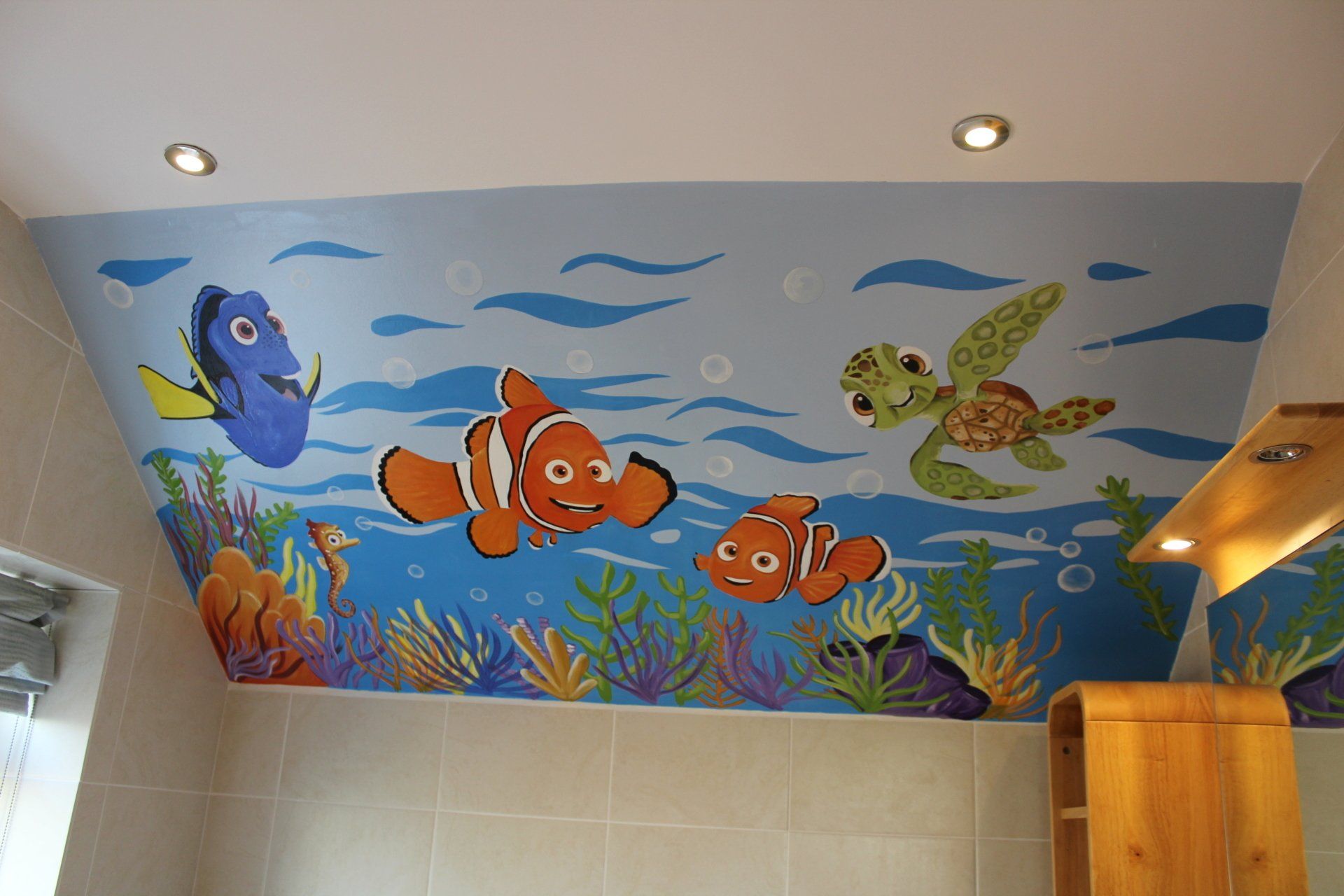 nemo under sea mural in kids ensuite bathroom