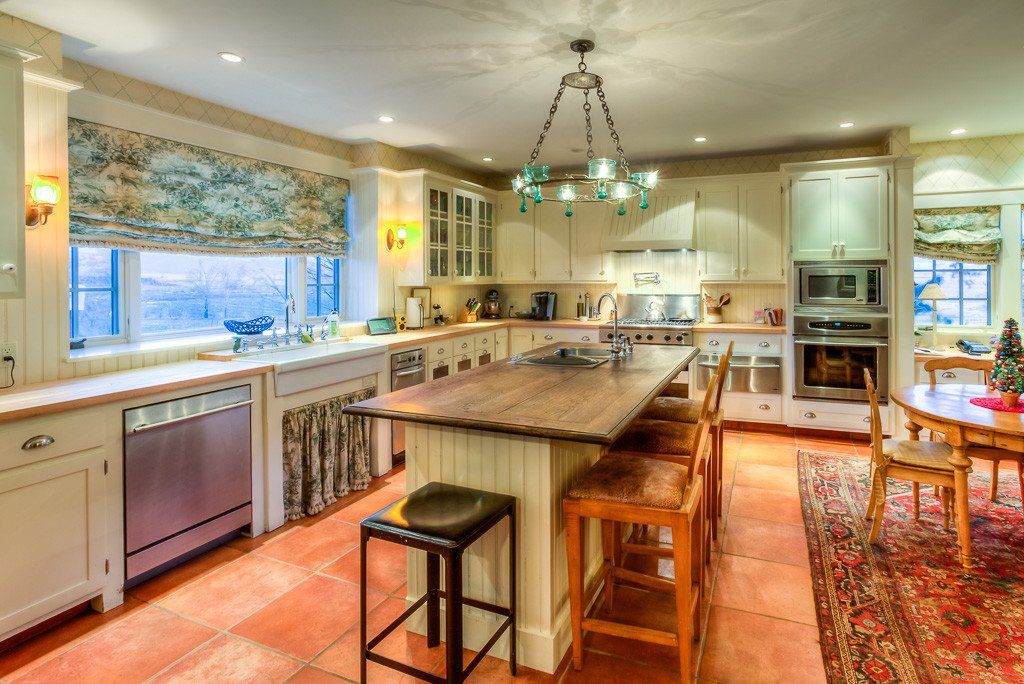 A large kitchen with a large island in the middle