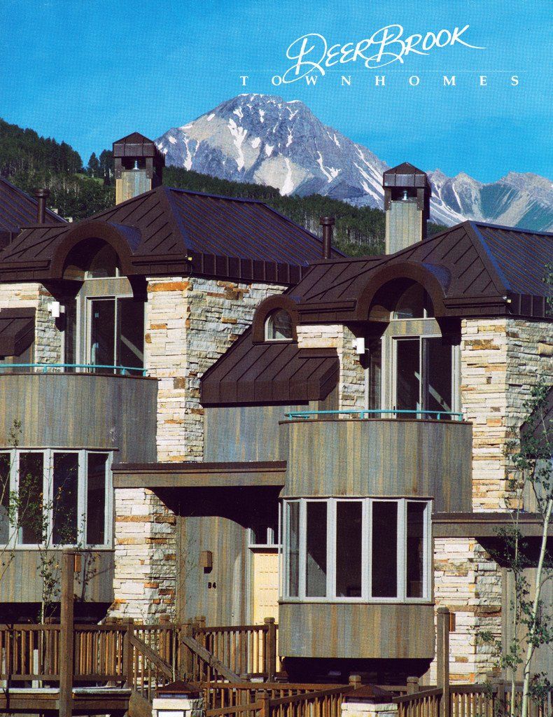 A brochure for deepbrook townhomes with mountains in the background