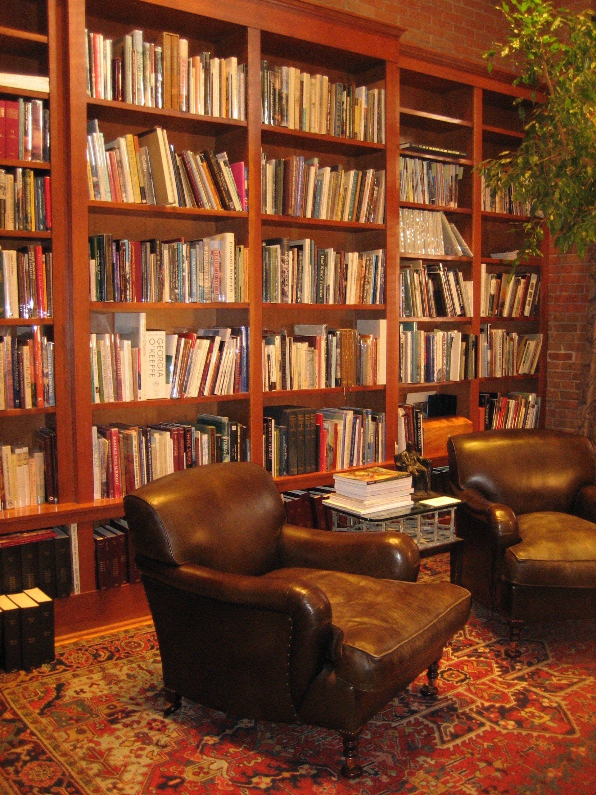 A library filled with lots of books and chairs