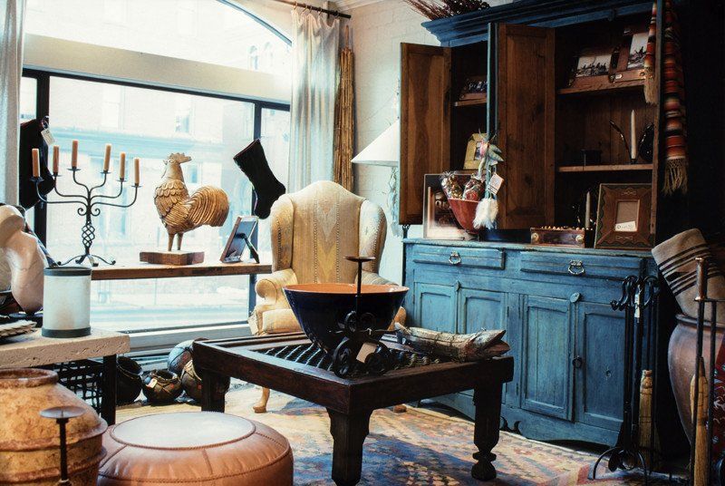 A living room filled with furniture and a large window