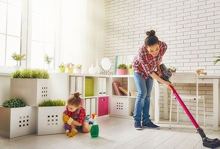 Mother and child clean the house — House Cleaning in Los Angeles, CA Mother and child clean the house — House Cleaning in Los Angeles, CA