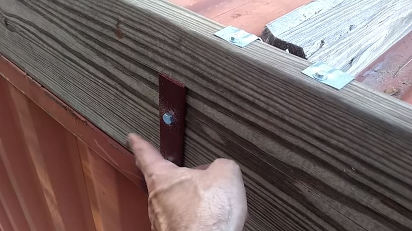 Attaching the reclaimed wood to the welded metal brackets 