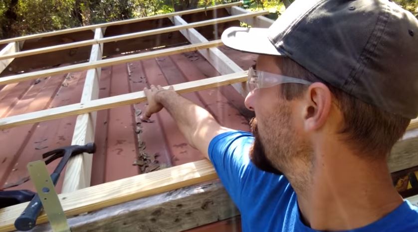 Attaching the 2x4's to the reclaimed wood and running 1x4's across