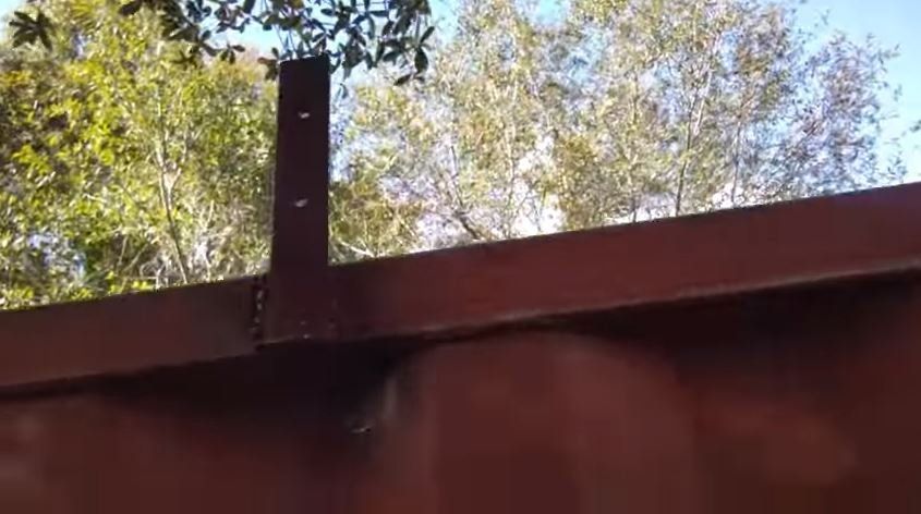 Metal brackets that were welded to the upper ride of the 8x40 cargo container 