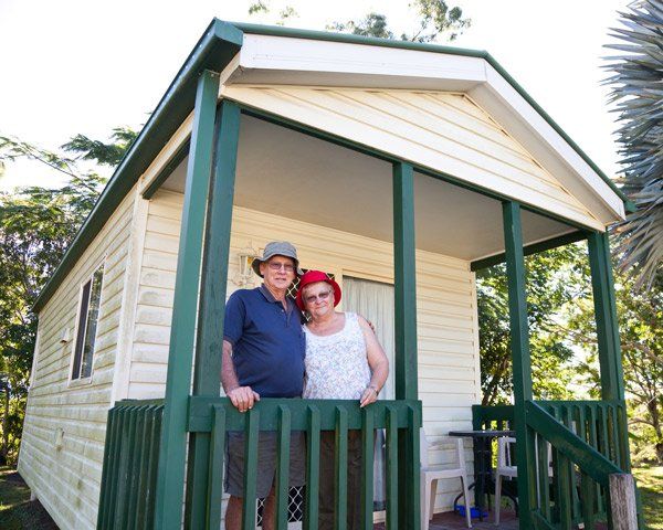 Mobile Home Financing — Seniors Couple in Front of Holiday Cabin in Allentown, PA Mobile Home Financing — Seniors Couple in Front of Holiday Cabin in Allentown, PA
