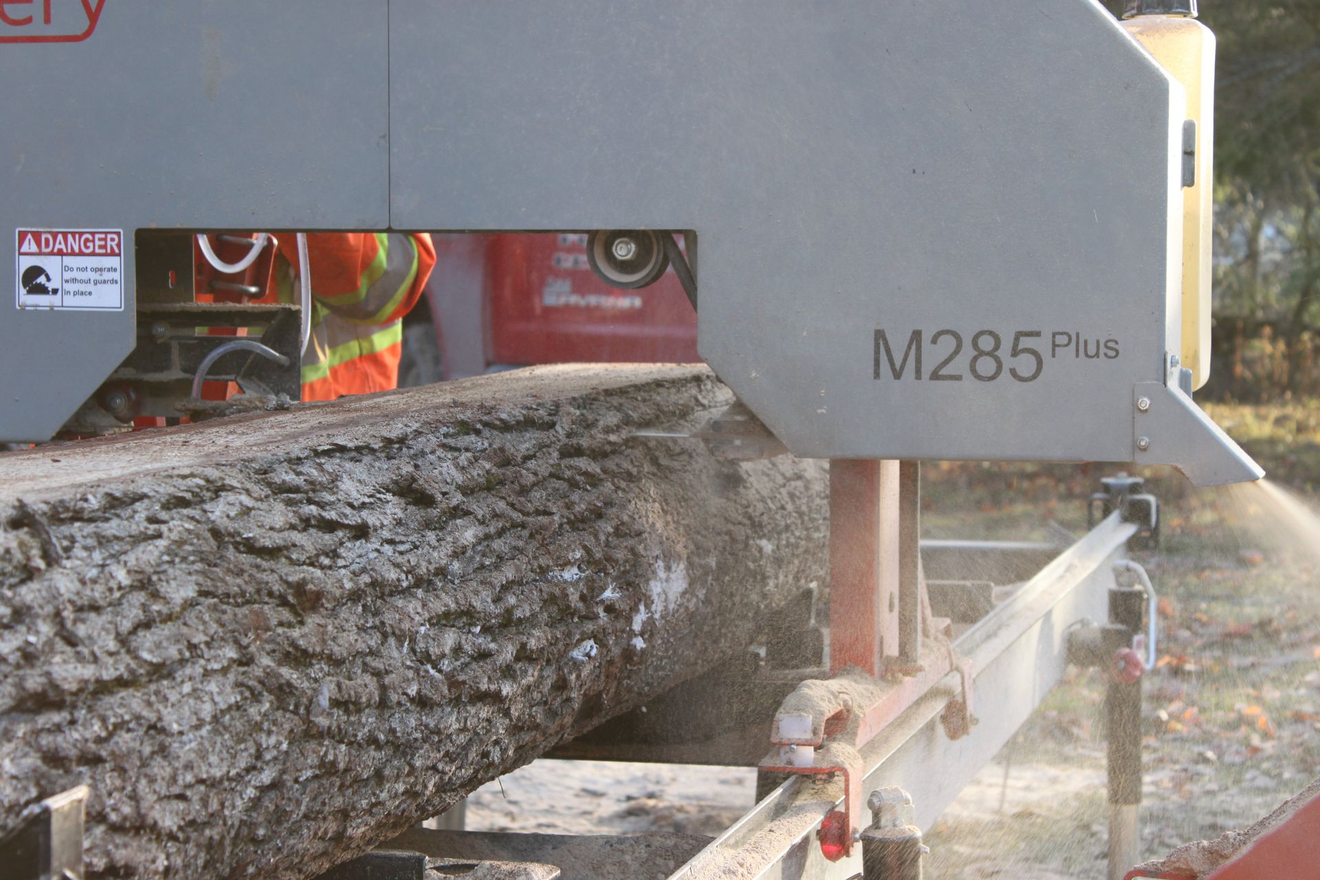 Up close action shot of Bruce sawing with Timbery M285 Sawmill