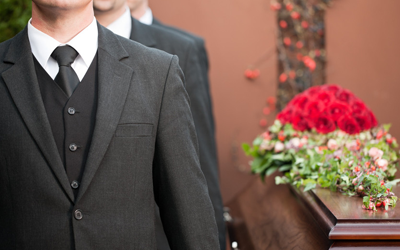 men standing in line to carry the coffin