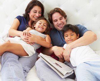 Bed Bug Infestation — Happy Family in Bed in New Castle, IndianaBed Bug Infestation — Happy Family in Bed in New Castle, Indiana Bed Bug Infestation — Happy Family in Bed in New Castle, Indiana