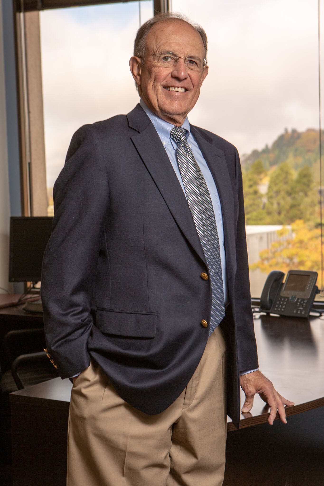 Business Attorney — Smiling Lawyer in An Office in Eugene, OR Business Attorney — Smiling Lawyer in An Office in Eugene, OR