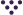 Six dark circles arranged in a triangular shape on a white background.