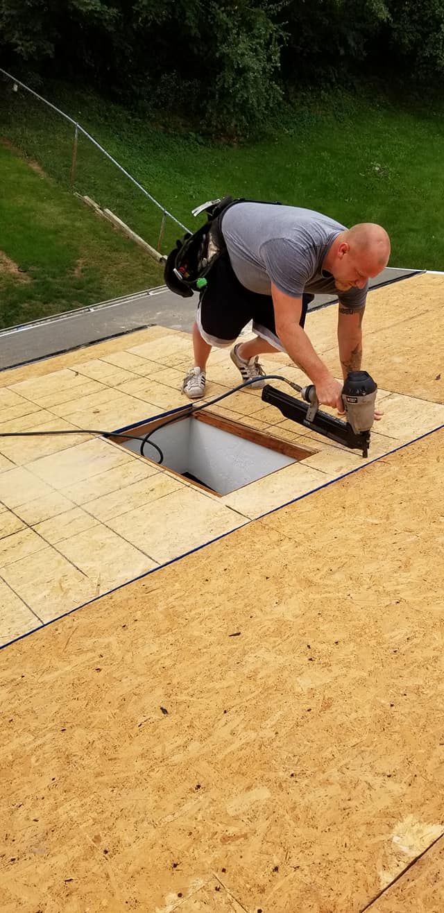 Man Putting Asphalt Shingles — Redford, MI — Bill's Home Maintenance