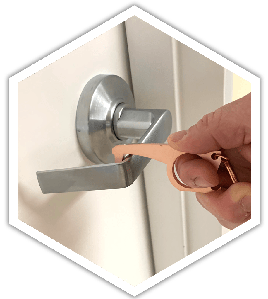 A person is using a keychain to open a door.