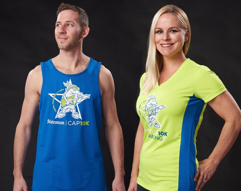 A man and a woman wearing blue and yellow shirts