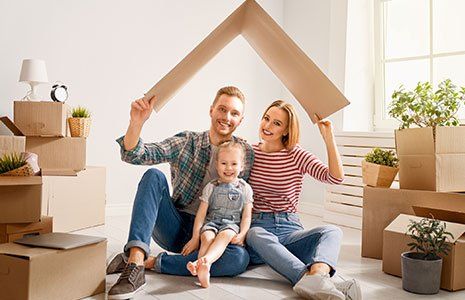 Happy Family in Their New House — Kingston, NH — Kingston Insurance Happy Family in Their New House — Kingston, NH — Kingston Insurance