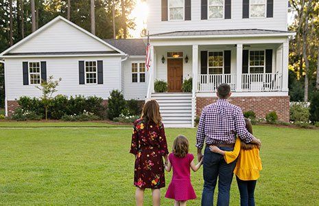 Family Standing Outside Front of New House — Kingston, NH — Kingston Insurance Family Standing Outside Front of New House — Kingston, NH — Kingston Insurance