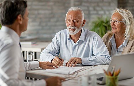 Senior Couple Signing Insurance Contract — Kingston, NH — Kingston Insurance Senior Couple Signing Insurance Contract — Kingston, NH — Kingston Insurance