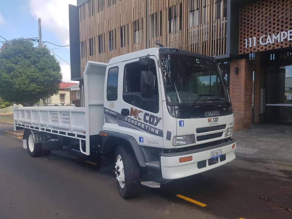 Worker Levelling Cement — Concreting in Westbrook, QLD