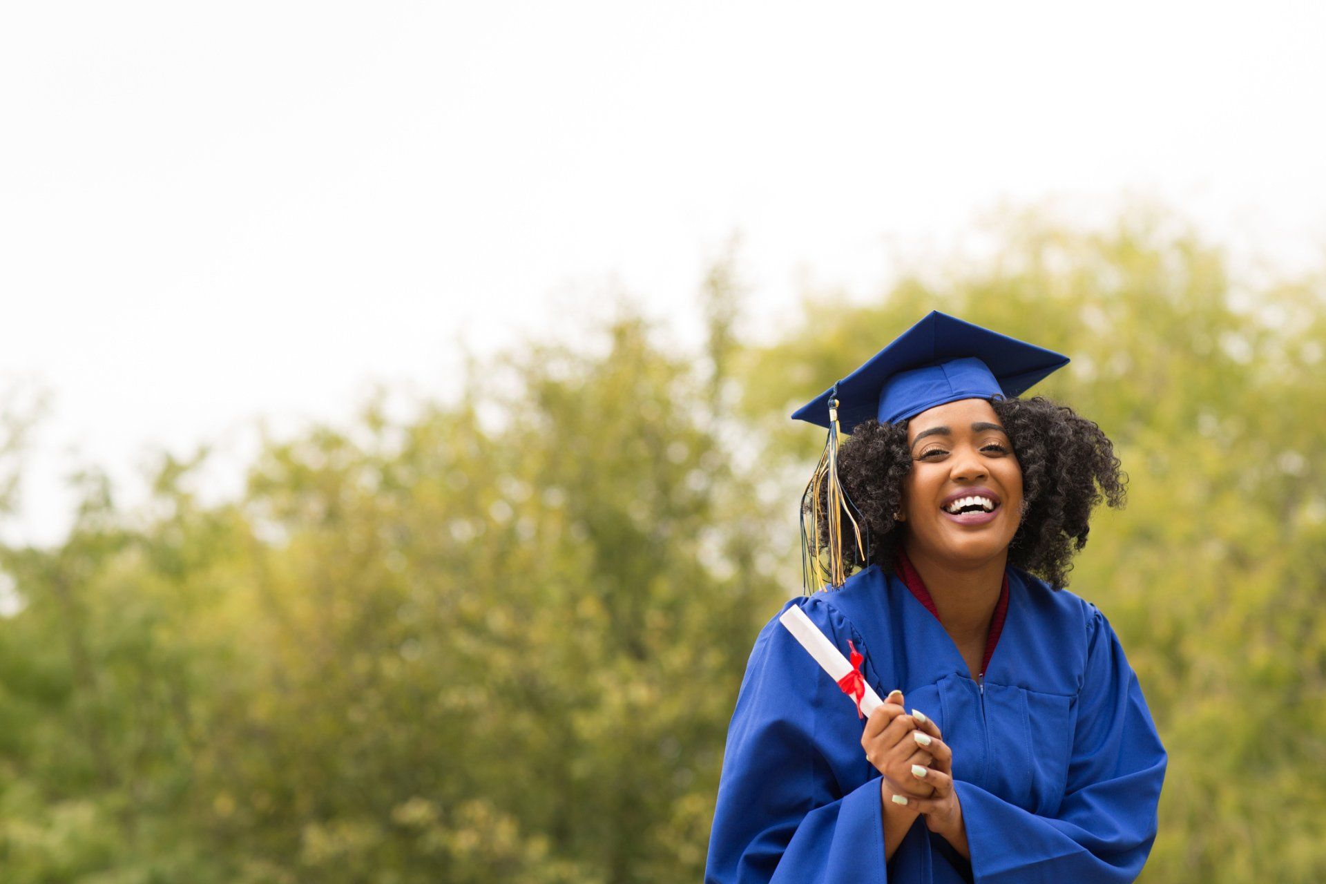 Baby Showers — Happy Woman Wearing Blue Academic Dress in Dayton, ME