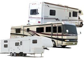 Three RVs of different types: a motorhome, a towable camper, and a larger RV.