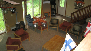 An aerial view of a living room with a table and chairs