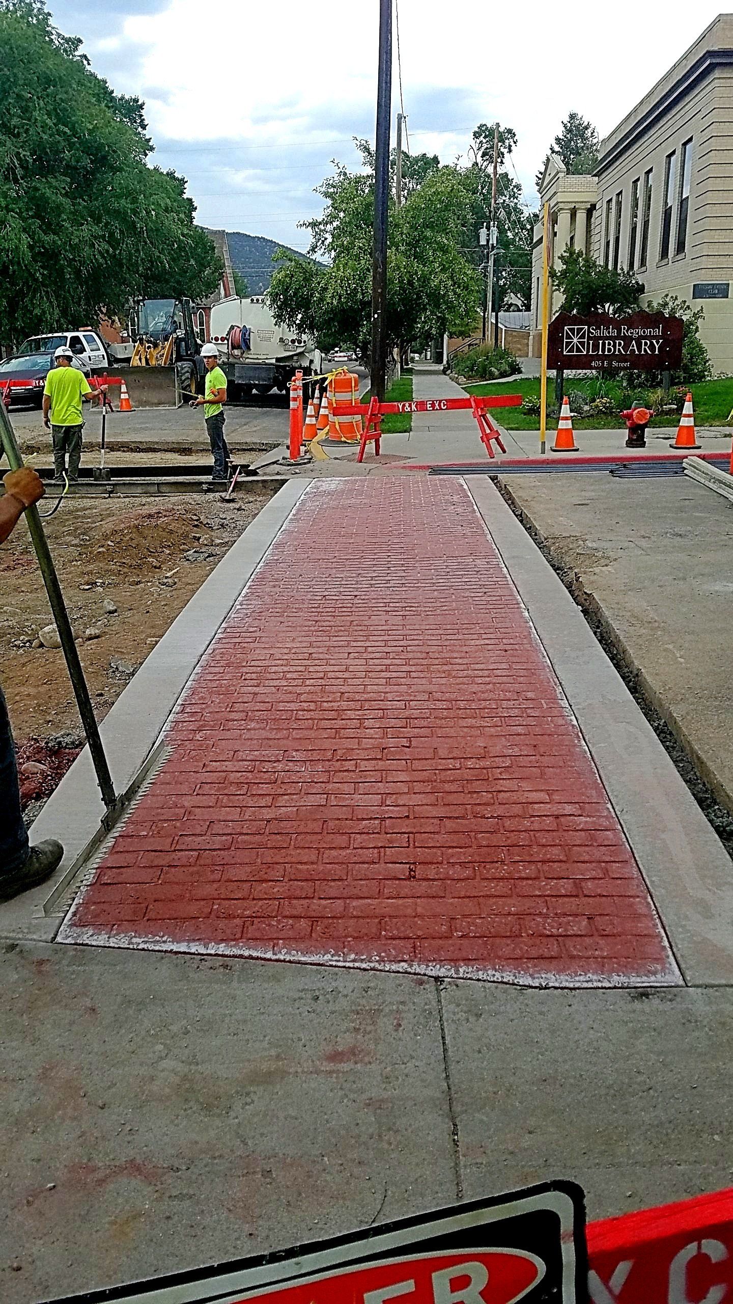 Colored & Stamped Concrete Sidewalk to Look like Brick
