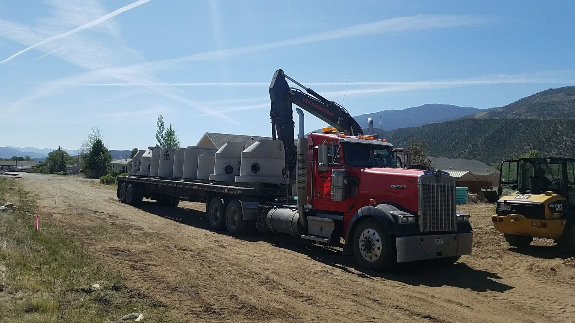 Concrete tanks being brought by semi