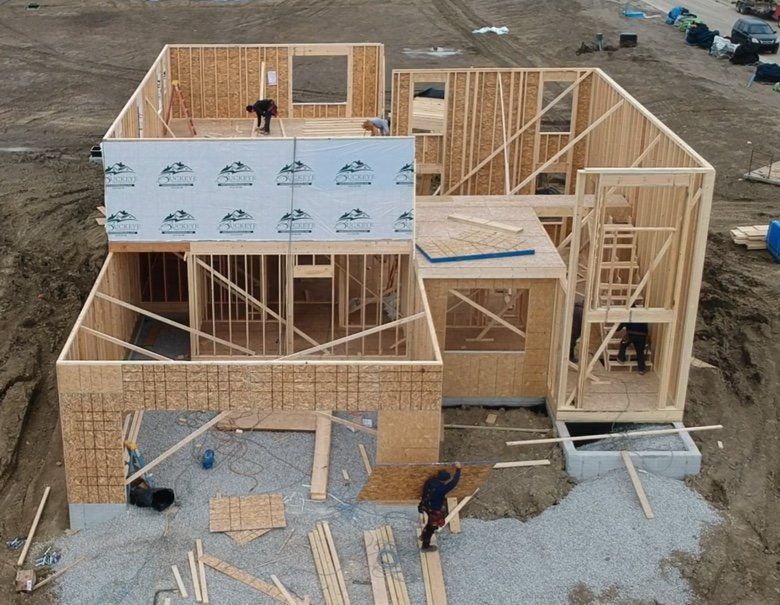 An aerial view of a house that is being built