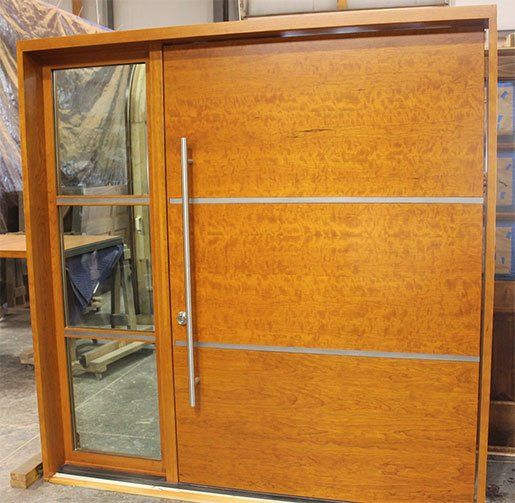 Wood Pivot Door with stainless steel inlay