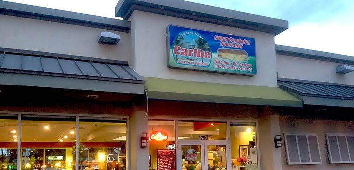 Exterior of a restaurant with a sign that says