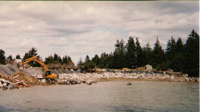 Shoreline Seawalls โ Seawall And Yellow Excavator in Thomaston, ME