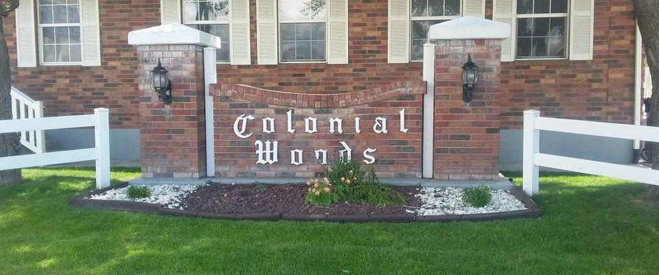 Colonial Woods sign at mobile home park