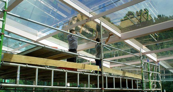 workers placing tint